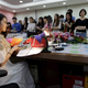 Online hostess Xianggong gives a live broadcast at a red wine promotion event